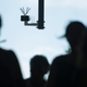 Passersby walk under a surveillance camera which is part of facial recognition technology test in Berlin.